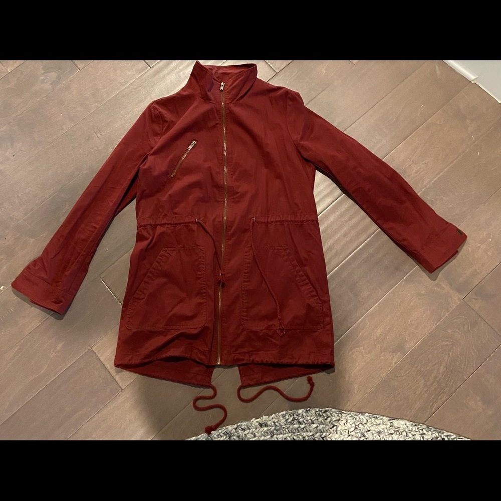 Reddish/Orange jacket.